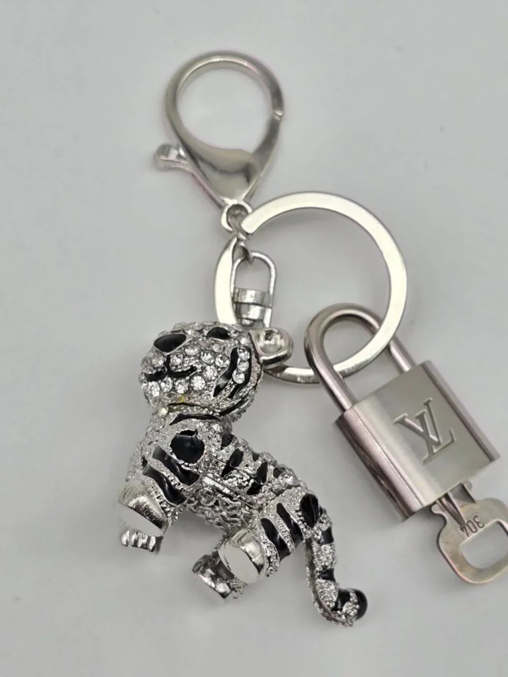 Authentic Louis Vuitton Silver Padlock with Unbranded Silver Tiger Bagcharm